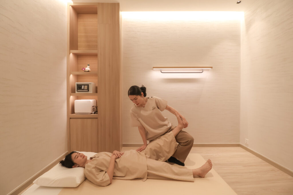 A woman having a Thai massage