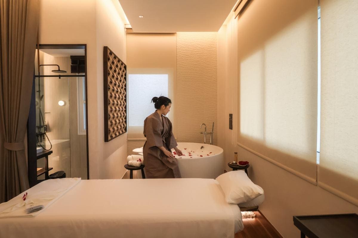 A guest getting ready for her milky bath spa in Bangkok