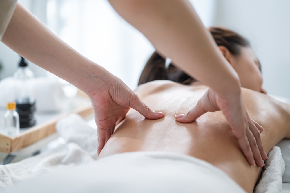 A woman enjoying a Thai massage and its benefits