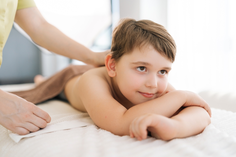 A 5-year-old boy getting ready for a massage
