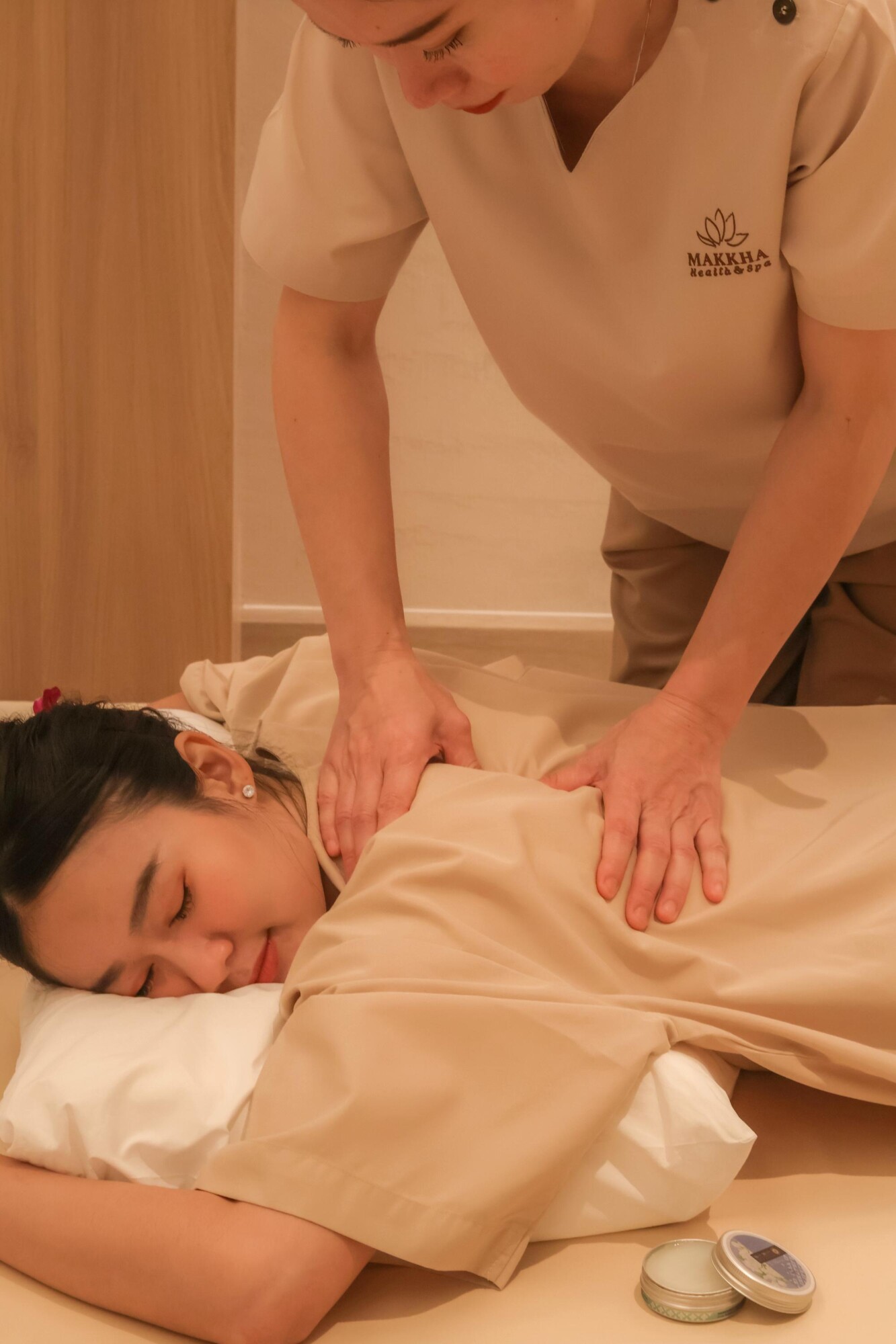 A woman enjoying a Thai massage and its benefits