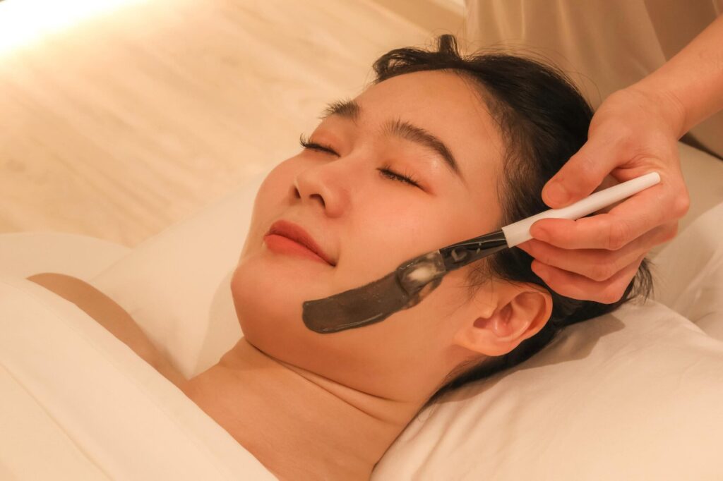 A woman receiving a facial massage