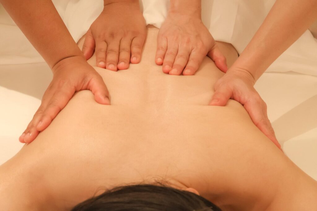 A man receiving a deep-pressure massage